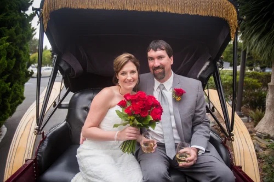 Bride and groom in private carriage for wedding event in Eureka California